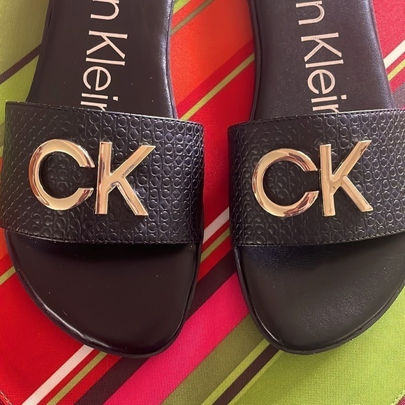 Brand New Calvin Klein Black Large Strap Sandals Flats w/ Gold Tone Metal Logo - Picture 4 of 12